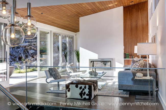 5939 marine drive - fireplace and view of patio with rockface beyond